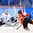 GANGNEUNG, SOUTH KOREA - FEBRUARY 18: Korea's So Jung Shin #31 makes a save off a shot from Switzerland's Alina Muller #25 during classification round action at the PyeongChang 2018 Olympic Winter Games. (Photo by Matt Zambonin/HHOF-IIHF Images)

